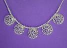 SWIRLY CIRCLES NECKLQCE